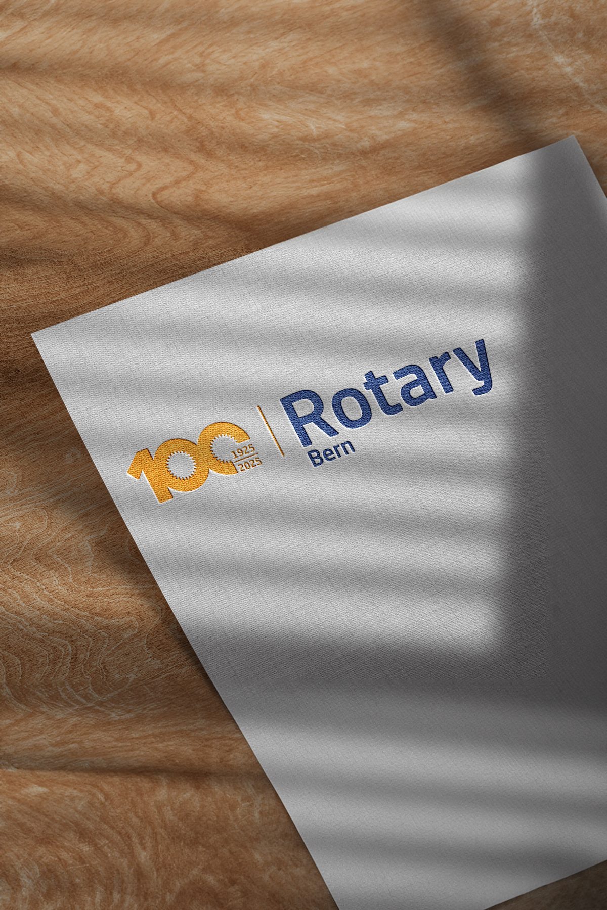 Jubiläumslogo 100 Jahre Rotary Club Bern auf Papier